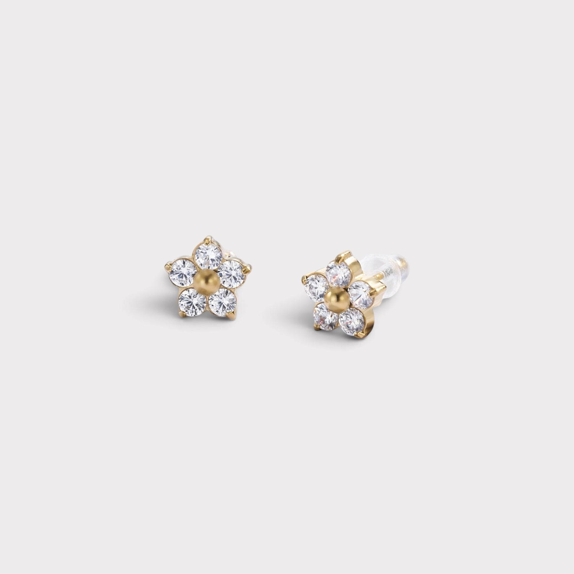 Verve floral stud earrings with sparkling cubic zirconia petals and a central gold-toned accent on a light background.